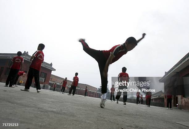 Students train at the Tagou Martial Arts School near the Shaolin Temple on Songshan Mountain, on August 22, 2006 in Dengfeng of Henan Province,...