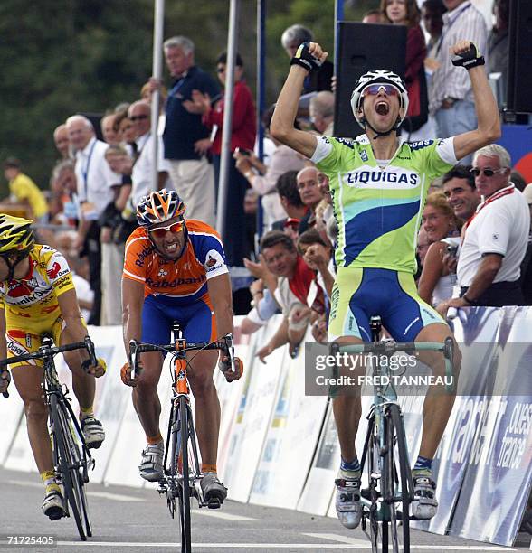 Italian Vincenzo Nibali raises his arms in victory as he crosses the finish line of the Grand Prix de Plouay cycling race, 27 August 2006 in Plouay,...