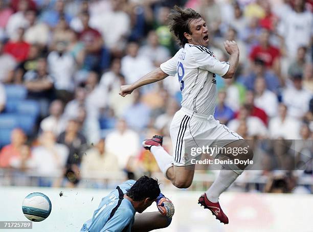 Antonio Cassano of Real Madrid is tackled by Diego Viera of Villarreal during a Primera Liga soccer match between Real Madrid and Villarreal at the...