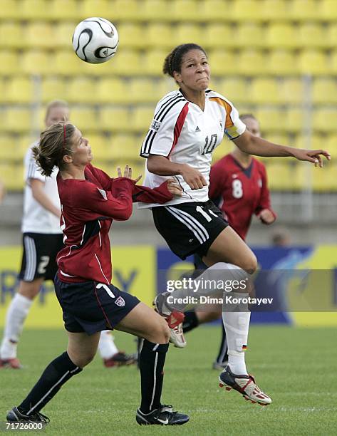 Amanda Poach of the United States challenges Celia Okoyino Da Mbabi of Germany during the FIFA Women's Under 20 World Championships Quarter-final...