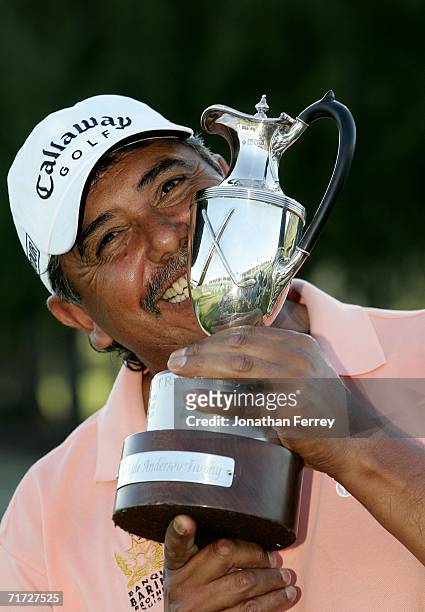 Eduardo Romero of Argentina celebrates with the trophy after winning during a playoff against Lonnie Neilsen during the final round of the Champions...