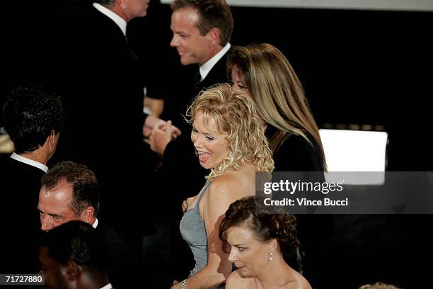 Actress Jean Smart applauds in the audience when "24" wins for Outstanding Drama Series at the 58th Annual Primetime Emmy Awards at the Shrine...