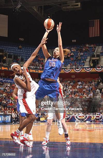 Ruth Riley of the Detroit Shock shoots against Asjha Jones of the Connecticut Sun in game three of the WNBA Eastern Conference Finals on August 27,...