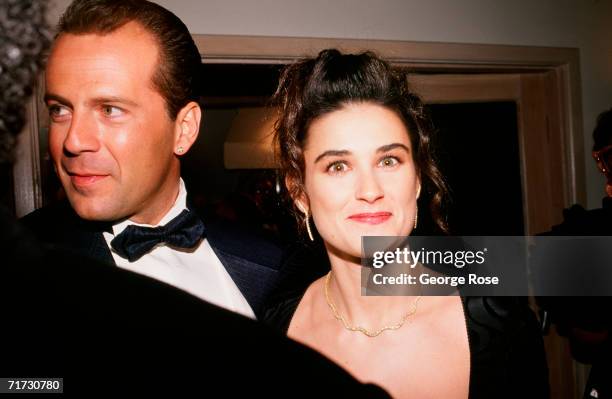 Actors Bruce Willis and Demi Moore arrive at the 1989 West Hollywood, California, Irving "Swifty" Lazar Oscar Party held at Spago.