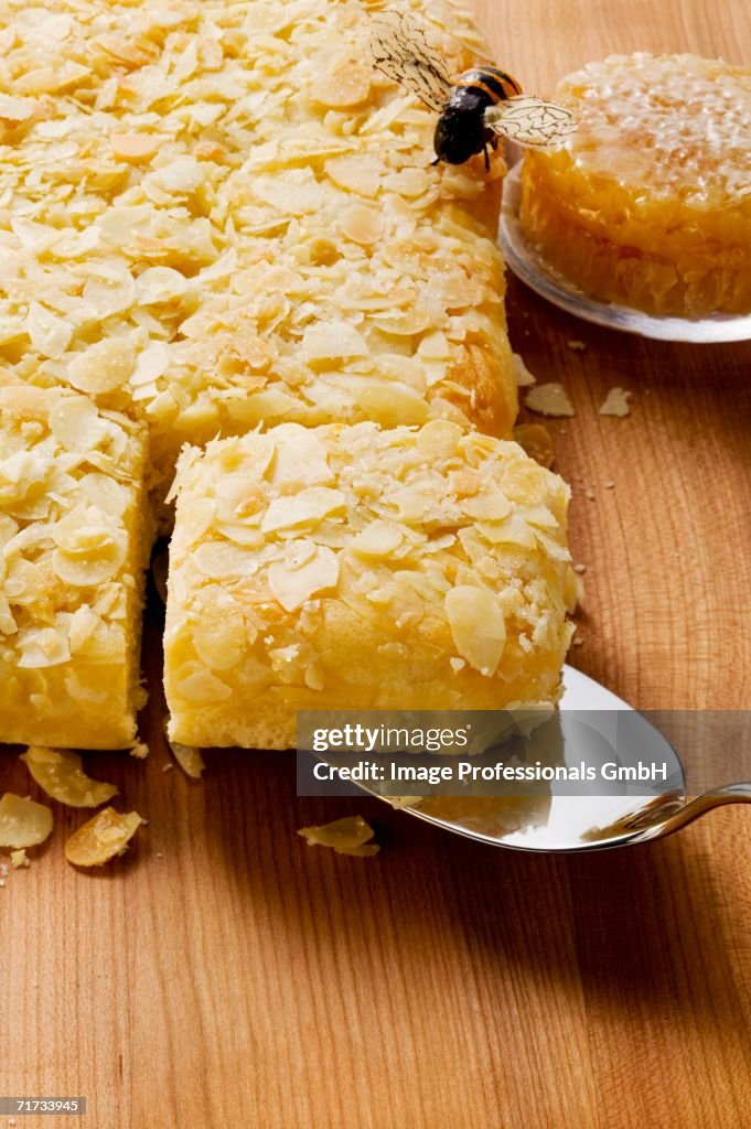 Bee sting cake with flaked almonds, bee and honeycomb