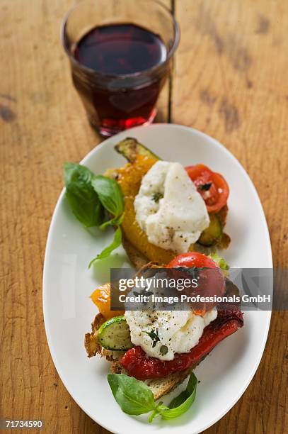 antipasti with stockfish and glass of red wine (italy) - pesce di mare foto e immagini stock