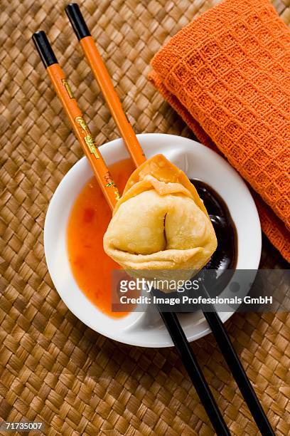 a deep-fried wonton with two sauces - hoisin sauce stock pictures, royalty-free photos & images