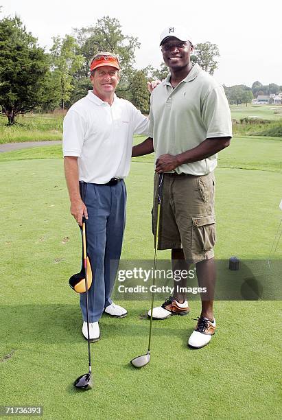 Pro-golfer Fred Funk and Kwame Jackson of "The Apprentice" pose for a photo during the Entertainment Golf Association?s celebrity golf tournament...