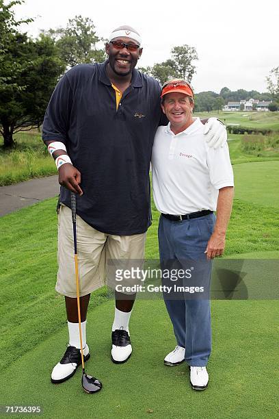 Pro-golfer Fred Funk and former NBA star Ike Austin pose for a photo during the Entertainment Golf Association?s celebrity golf tournament presented...