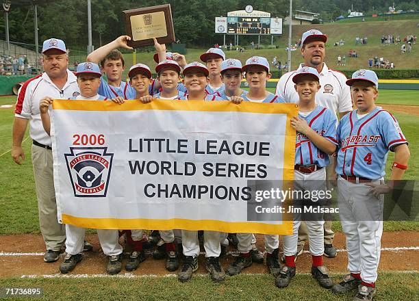 The Southeast team from Columbus, Georgia pose with their banner after defeating the Asian team from Kawaguchi City, Japan during the Championship...