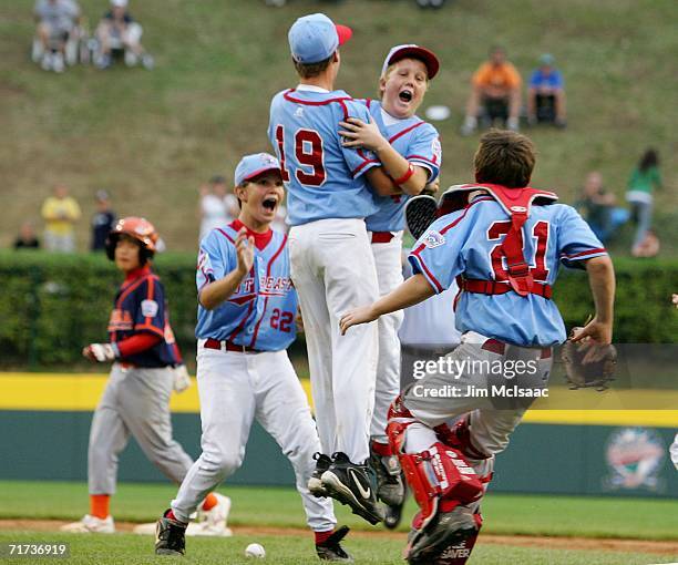 Josh Lester, Kyle Carter , J.T. Phillips, and Cody Walker of the Southeast team from Columbus, Georgia celebrate after defeating the Asian team from...
