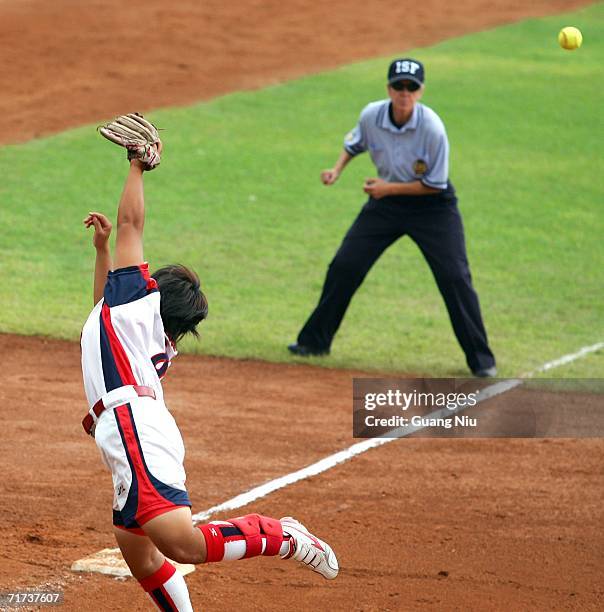 Megu Hirose of Japan tries to catch a ball during the match against Greece at the ISF XI Women's Fast Pitch Softball World Championship at the...