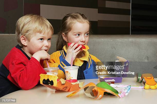 Children eat a new Happy Meal at the McDonald's restaurant in Collingwood on August 29, 2006 in Melbourne, Australia. The new Happy Meal is a low fat...