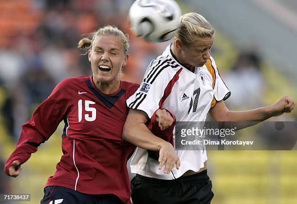 Carrie Dew of the United States and Lydia Neumann of Germany head the ball during the FIFA Women's Under 20 World Championships Quarter-final match...