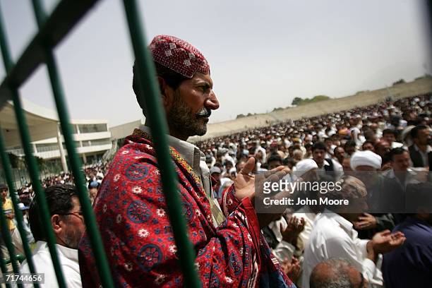 Supporters of slain Bugti tribal cheif Nawab Bugti pray at a memorial service for him August 29, 2006 in Quetta, Pakistan. Afterwards, more than a...