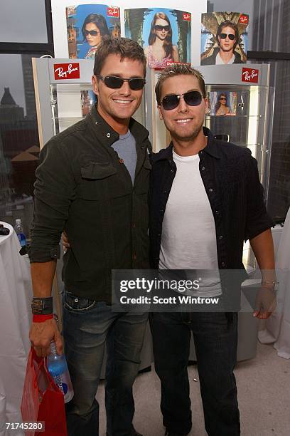 Singer Lance Bass and Riechen Lehmkuhl visit the Ray-Ban booth at the VMA Style Villa at the Bryant Park Hotel August 29, 2006 in New York City.