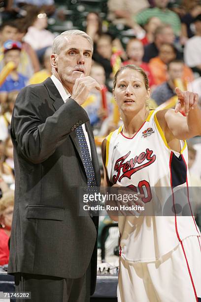 Head coach Brian Winters of the Indiana Fever speaks to Anna DeForge during play against the Detroit Shock during the WNBA Eastern Conference...