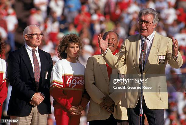 49ers Hall of Famers Y.A. Tittle, Joe Perry stand next to Bob St. Clair who speaks to the fans during a game between the San Francisco 49ers and...