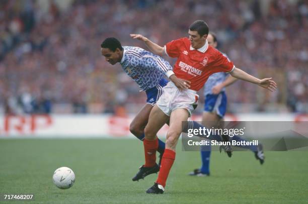 Paul Ince of Manchester Utd holds onto the ball from the Nottingham Forest defender Roy Keane during their Rumbelows Football League Cup Final match...