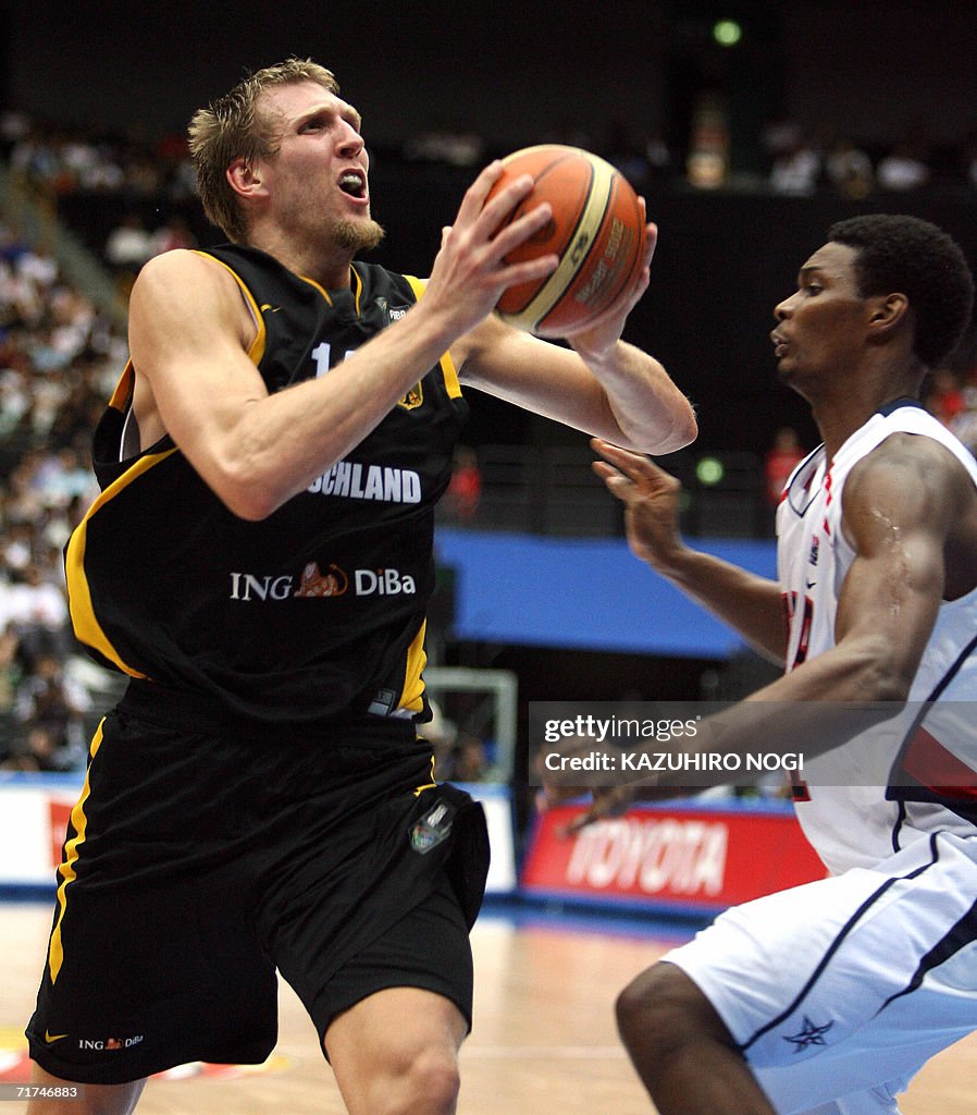 German player Dirk Nowitzki (L) attempts