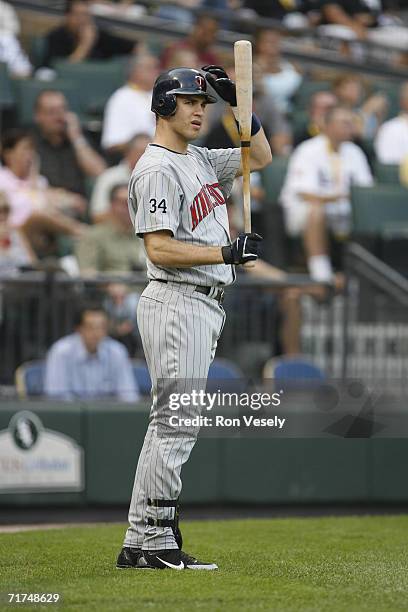 Joe Mauer of the Minnesota Twins waits in the on deck circle during the game against the Chicago White Sox at U.S. Cellular Field in Chicago,...