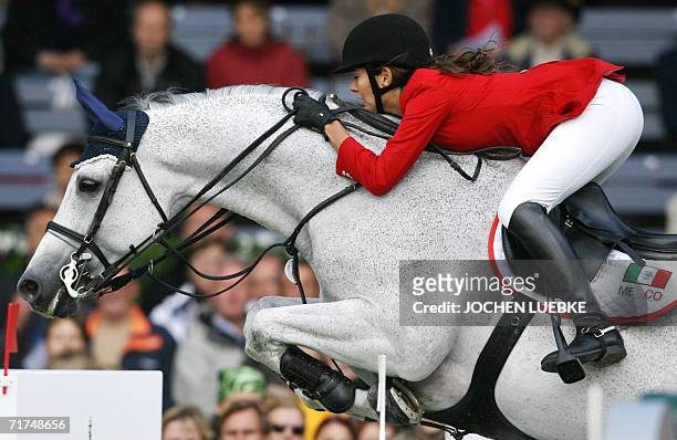 Mexican rider Marcela Lobo on "Joskin" jumps during the first round of the jumping competition of the World Equestrian Games in Aachen, 30 August...