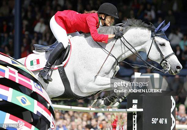 Mexican rider Marcela Lobo on "Joskin" jumps during the first round of the jumping competition of the World Equestrian Games in Aachen, 30 August...