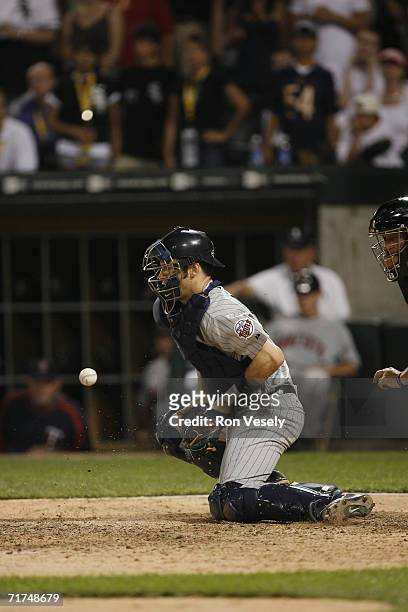 Joe Mauer of the Minnesota Twins blocks a pitch in the dirt while catching during the game against the Chicago White Sox at U.S. Cellular Field in...