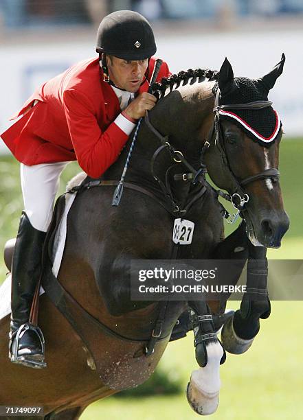 Canadian rider Eric Lamaze on "Hickstead" jumps during first round of the jumping competition of the World Equestrian Games in Aachen, 30 August...