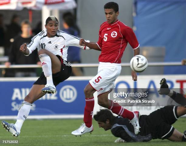 Boateng Kevin-Prince, of Germany fights for the ball with Switzerlands Keeper, Huber Manuel, on the ground, and Barmettler Heinz during the Under 20...