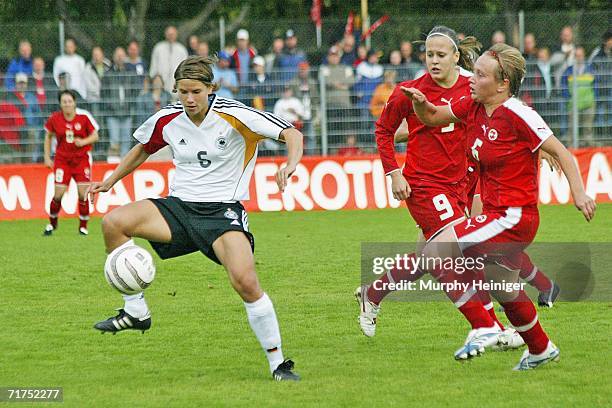 Navina Omilade of Germany battles for the ball against Vanessa Buerki and Noemie Berney of Switzerland Women's FIFA World Cup qualifying match...