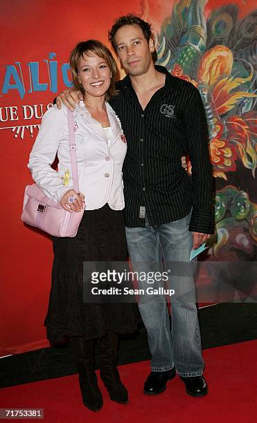 Television hostess Andrea Ballschuh and friend Jem arrive for the Dralion Cirque de Soleil circus premiere August 30, 2006 in Berlin, Germany.