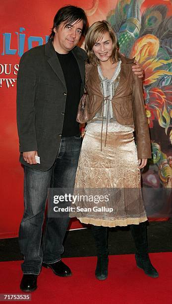 Actress Gesine Cukrowski and partner Michael Helfrich arrive for the Dralion Cirque de Soleil circus premiere August 30, 2006 in Berlin, Germany.
