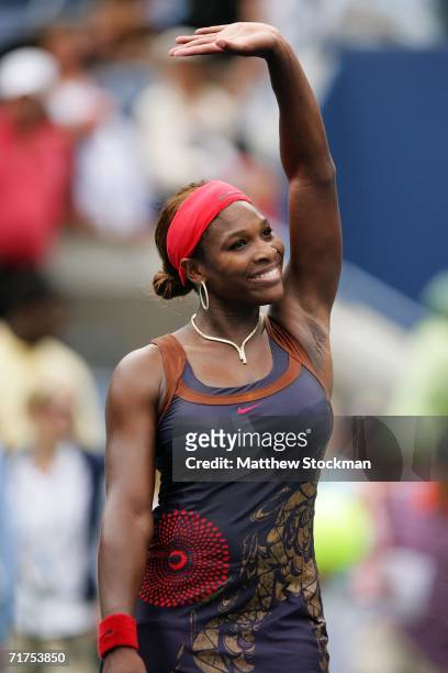 Serena Williams waves to the crowd after beating Lourdes Dominguez Lino of Spain in straight sets during the U.S. Open at the USTA Billie Jean King...