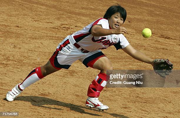 Megu Hirose of Japan jumps for the ball during a match against Botswana at ISF XI Women's Fast Pitch Softball World Championship at the Fengtai...