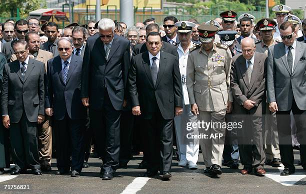 Egyptian President Hosni Mubarak leads a military funeral procession for Egyptian novelist and Nobel laureate Naguib Mahfouz in Cairo, 31 August...