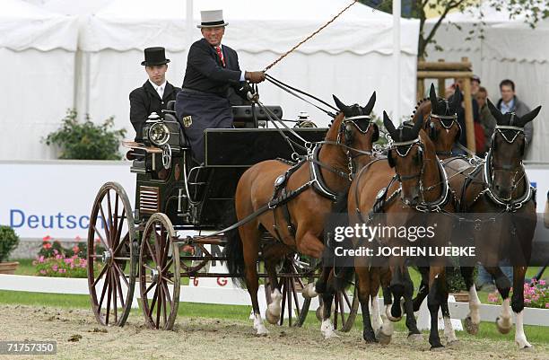 Michael Freund of Germany competes in the Four-in-Hand Driving dressage competition of the World Equestrian Games in Aachen 31 August 2006. The games...