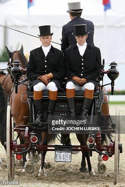 Chester Weber of the US and his co-drivers compete in the Four-in-Hand Driving dressage competition of the World Equestrian Games in Aachen 31 August...