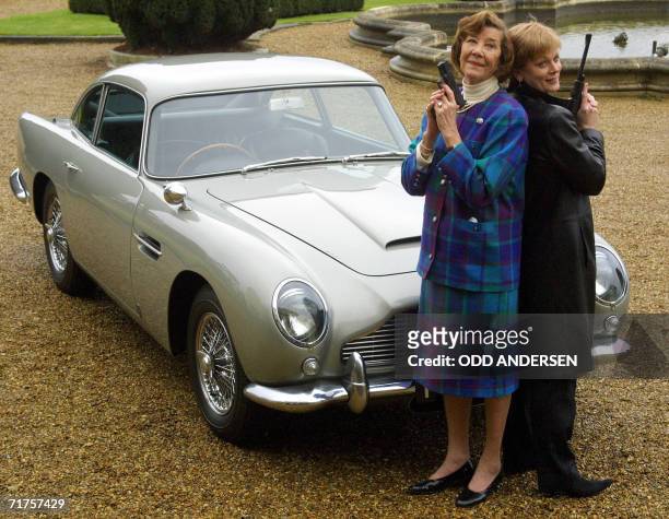 Slough, UNITED KINGDOM: TO GO WITH AFP STORY: US-Britain-auto-company In this 02 February file photo, the first Miss Moneypenny, Lois Maxwell and the...