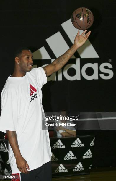 Player Tracy McGrady of the Houston Rockets demonstrates his skills during a ceremony to launch an Adidas shoe at his second visit to Hong Kong on...