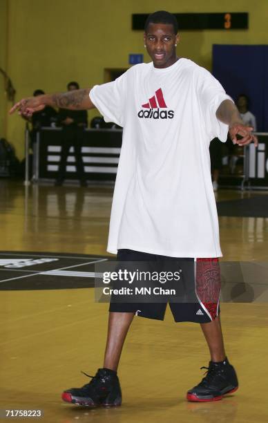Player Tracy McGrady of the Houston Rockets demonstrates his skils during a ceremony to launch an Adidas shoe at his second visit to Hong Kong on...