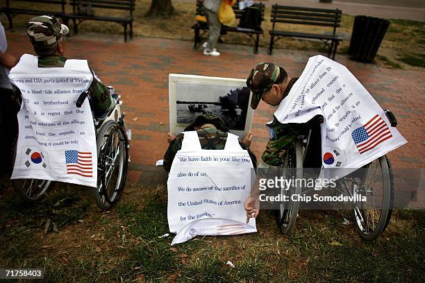 Republic of Korea Armed Forces veteran Chong Il Kim of Seoul , who suffers from throat cancer that he says is due his exposure to Agent Orange while...