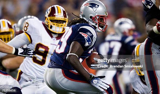 Running back Laurence Maroney of the New England Patriots carries the ball during a preseason game against the Washington Redskins at Gillette...