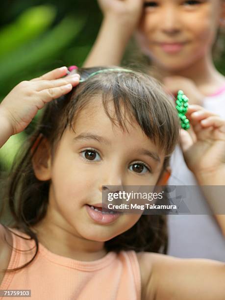 portrait of a girl with her hands on her head - fake of indian girls stock pictures, royalty-free photos & images