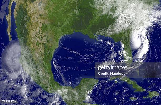 In this satellite image provided by the National Oceanic and Atmospheric Administration, Tropical Storm Ernesto is shown at 9:45 am EDT is shown east...