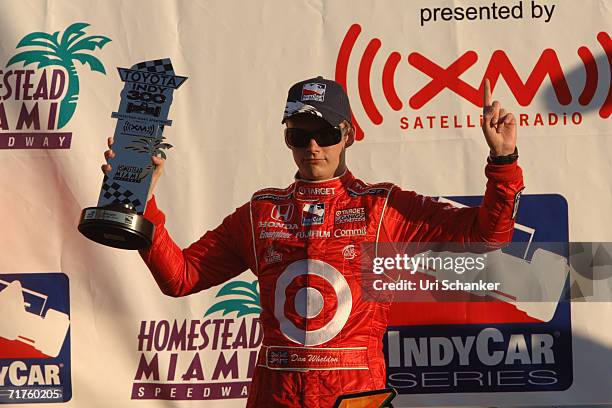 Dan Weldon winner of the Toyota 300 IRL Race held at Homestead Miami Speedway holds up is trophy on March 26, 2006 in Miami, Florida.