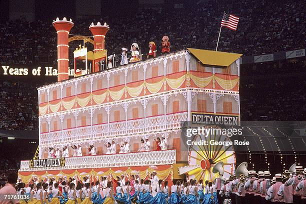 Mardi Gras style Showboat float with people dancing rolls by during the pregame show before the San Francisco 49ers take on the Denver Broncos prior...