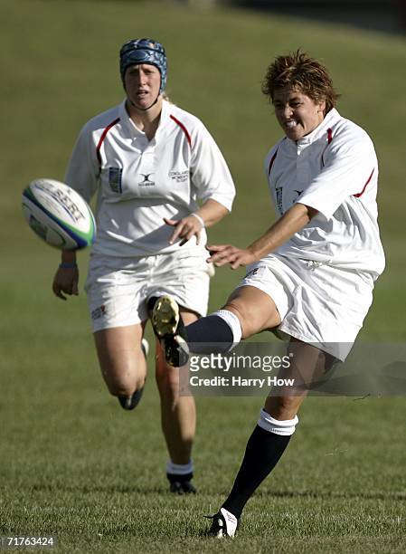 Shelley Rae of England kicks the ball in front of teammate Tamara Taylor in the match against USA during the Women's Rugby World Cup at Ellerslie...
