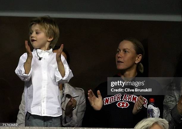 Andre Agassi's son, Jaden, cheers with Rennae Stubbs of Australia, during the match between Andre Agassi and Marcos Baghdatis of Cyprus during the...