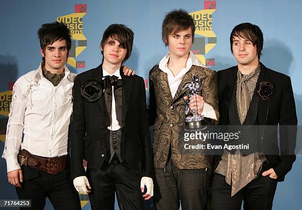 Musicians Brendon Urie, Ryan Ross, Spencer Smith and Jon Walker of Panic! At The Disco pose in the press room with their award for "Video of the...